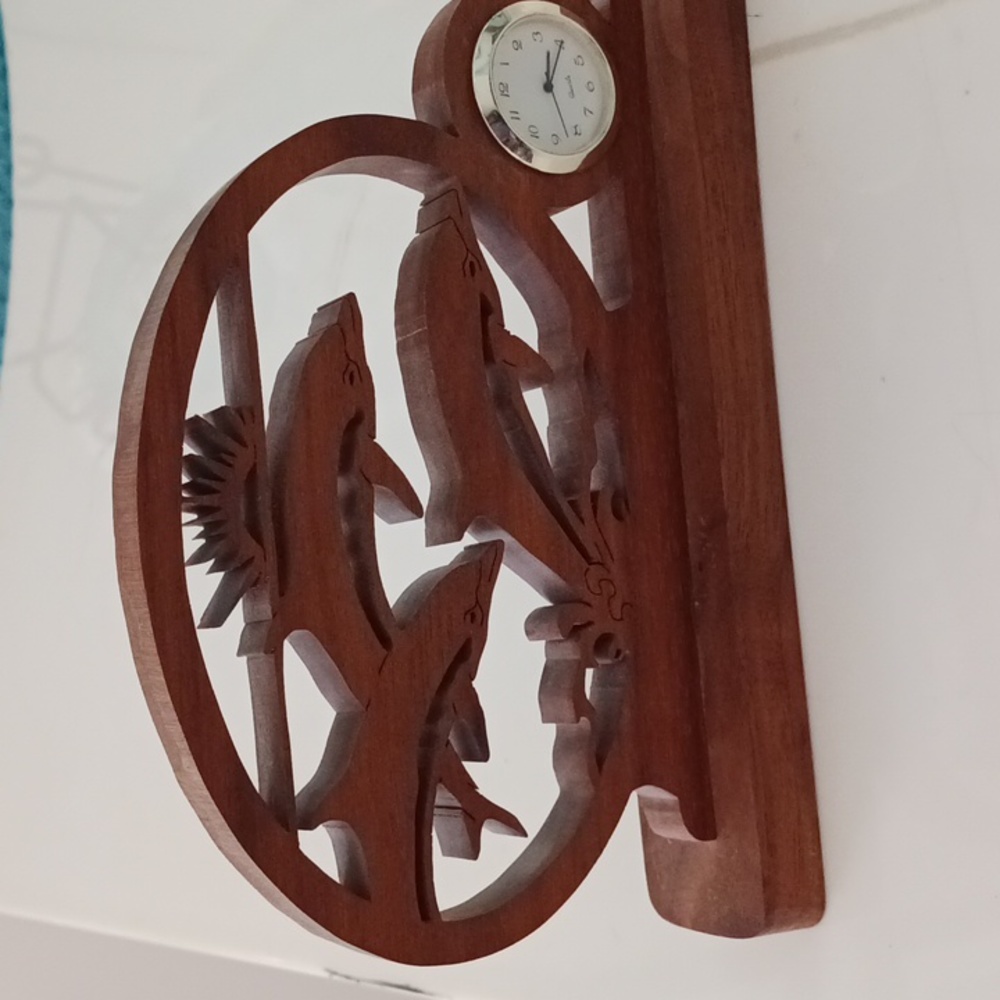 Teak Hand carved dolphin with small clock.